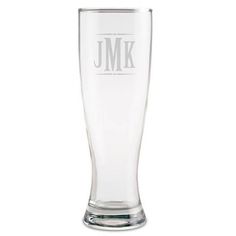 a tall glass with the word j m on it