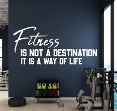 there is a gym wall decal that says fitness is not a destination it is a way of life