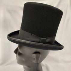 Broadway Quality, Made In Usa, 100% Wool Squire 6.25" Top Hat. Color: Black American / Nearest 1/8 Inch / Metric Cm / Size Code 6 3/4 21 1/8 54 Small 6 7/8 21 1/2 55 Small / Child L Broadway Quality Made In Usa By Hxc Hatcrafters Inc. These Hats Are Of High Quality And No Longer Manufactured So The Sizes And Quantity Available Are Finite. We Also Cannot Accept Lower Bids On These Hats As They Are Already At Reduced Prices. Adjustable Solid Top Hat With Short Brim, Classic Adjustable Costume Hats And Headpieces For Winter, Classic Black Boater Hat With Curved Brim, Black High Crown Hat For Formal Occasions, Black High Crown Costume Hat For Formal Occasions, Formal Black High Crown Costume Hat, Adjustable Black Hat Band For Kentucky Derby, Black Hat Bands For Kentucky Derby With Curved Brim, Fitted Solid Hats For Kentucky Derby