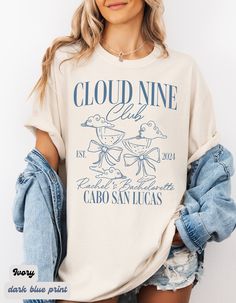 a woman wearing a t - shirt that says cloud nine club