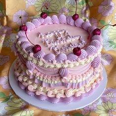 a cake that is sitting on top of a plate with the words happy birthday written in frosting