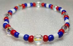 Red, blue, and white bracelet with clear crystal gems :). Blue Stretch Bracelet For 4th Of July Gift, Blue Beaded Patriotic Stretch Bracelet, Patriotic Blue Beaded Stretch Bracelet, White Bracelets For 4th Of July Gift, White Patriotic Bracelet As Gift, White Handmade Patriotic Bracelet, Patriotic White Stretch Bracelet As Gift, Patriotic White Stretch Bracelet Gift, Handmade White Patriotic Bracelet