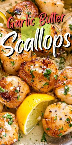 garlic butter scallops in a pan with lemon wedges and parsley