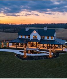 an aerial view of a large house at dusk