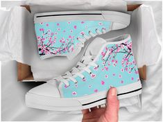 Super cute sakura shoes to complate your cute style! Product Names: Sakura Custom Shoes, Cute Shoes / Sneakers, Cherry Blassom Tree High Top Shoes, Blue Green Mint Shoes for Women's Check out more of our footwear here: https://www.etsy.com/shop/unicornshoesshop/ Product Features; ▶ Full canvas double sided print with rounded toe construction ▶ Lace-up closure for a snug fit. ▶ Soft textile lining with lightweight construction for maximum comfort. ▶ High-quality EVA outsole for traction and excep Personalized Shoes, Flower Shoes, Sakura Flower, Shoes Custom, Trendy Sneakers, Latest Shoes, High Top Shoes, Dinosaur Print, Custom Shoes