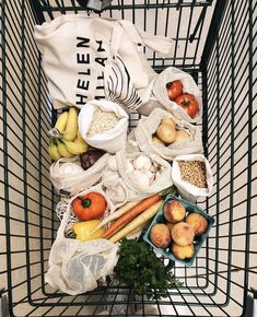 a shopping cart filled with fruits and vegetables