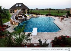 a backyard with a swimming pool and waterfall