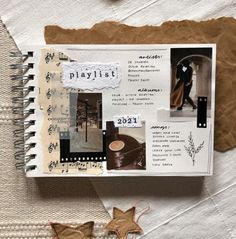 a book with pictures and words on the pages next to a star shaped object that says playlist