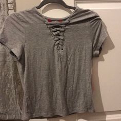 This Is A Nwt Size Large Lace Up T-Shirt In Light Heather Gray. It Is A Soft Cotton Material With A Sexy Lace Up Design In The Front. The Brand Is Hot Kiss & Was Purchased At Tj Maxx. My Items Come From A Smoke Free/Pet Free Home :) Basic Tan Short Sleeve Tops, Tan Crew Neck Casual Top, Casual Tan Crew Neck Top, Basic Tan Tops For Spring, Fitted Tan T-shirt With Short Sleeves, Fitted Tan Short Sleeve T-shirt, Casual Tan Short Sleeve Tops, Lace Up T Shirt, Hot Kiss