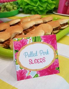 a table topped with lots of sandwiches and plates