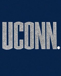 the word uconn written in silver glitter on a dark blue background