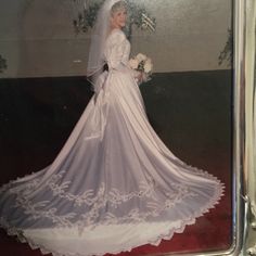 an old photo of a woman in a wedding dress