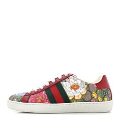 This is an authentic pair of GUCCI GG Supreme Monogram Flora Web Womens Ace Sneakers Size 35 in Beige, Multicolor and Rosso. These stylish sneakers are crafted of beige Gucci GG monogram coated canvas, with a vibrantly colored floral print overlay, and red leather trim. The shoes feature white rubber soles, matching laces, a red and green nylon web stripe at the sides, and metallic red and green leather accents at the heel. Gg Monogram, Leather Accents, Green Leather, Stylish Sneakers, Leather Trim, Leather Trims, Red Leather, Floral Print, Floral Prints