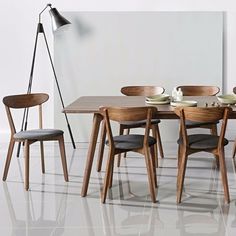 a dining room table with chairs around it