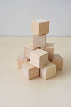 several wooden blocks stacked on top of each other