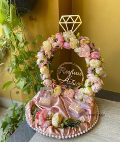 a table topped with a cake covered in flowers