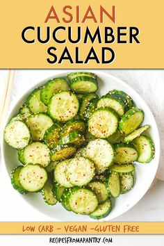 a white bowl filled with sliced cucumbers next to chopsticks