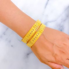 This exquisite pair of 22k gold bangles, with a total weight of 35.4 grams, features an elevated regal floral design that exudes sophistication and elegance. The yellow gold finish enhances their luxurious appeal, making them perfect for any special occasion. Each bangle has a size of 2.6 and an opening diameter of 2.35 inches, offering both style and comfort. These bangles are openable, designed with a screw and hinge for added convenience. Ideal for those who appreciate high-quality craftsmanship and timeless beauty, these regal floral gold bangles are a cherished addition to any jewelry collection. PRODUCT DETAILS Gold Purity(karat): 22k Gold Weight(grams): 35.4 Item Finish: Yellow Gold Bangle Size: 2.6 Bangle Opening(diameter): 2.35" Openable: Yes, Screw w/ Hinge Number Of Pieces: 2 Ba Luxury Gold Plated Bangle With Intricate Design, Luxury Gold-plated Bangle With Intricate Design, Yellow Bangle With Intricate Design, Luxury 22k Gold Hand Set Bangle, Luxury 22k Gold Bangle For Ceremonial Occasions, 22k Yellow Gold Bangle For Formal Occasions, Yellow Bangle Bracelet With Intricate Design, Yellow Bangle Bracelets With Intricate Design, Yellow Gold Bracelet With Intricate Design For Wedding