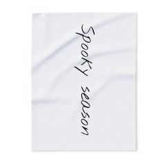 a piece of paper with the word sorry written on it in black ink, against a white background