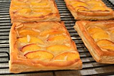 four pieces of pie sitting on top of a cooling rack