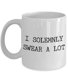 a white coffee mug that says i solemnly swear a lot on the inside of it