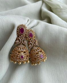 TEMPLE JHUMKA Kemp Ruby Stones Jhumka Earrings/Light weight /Antique Gold Finish/Indian Jewelry/desi jewelry / indian jhumkas Size : 3 inches approx  light weight  Elevate your style with these exquisite Temple Jhumka Earrings adorned with vibrant Kemp Ruby Stones and finished in antique gold. These Indian-inspired jhumkas are designed for both elegance and comfort, measuring approximately 3 inches in length and crafted to be delightfully lightweight. Embrace the timeless charm of desi jewelry with these stunning Indian jhumkas. Desi Jewelry, Jhumka Designs, Perhiasan India, Pretty Jewelry Necklaces, Fancy Jewellery Designs, Jewelry Set Design, Multicolor Earrings, Indian Jewellery Design Earrings, Indian Jewellery Design