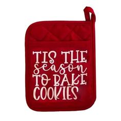 a red oven mitt that says tis the season to bake cookies