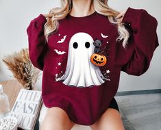 Halloween Cute Ghost Sweatshirt, Black Cat Sweater, Halloween Party Sweatshirt for Women, Halloween Sweater, Spooky Sweatshirt, IPrintasty Get cozy and spooky this Halloween with our Halloween Cute Ghost Sweatshirt! Designed for women who love to embrace the spirit of the season, this sweatshirt is perfect for everything from festive gatherings to relaxed autumn evenings. With its adorable ghost design and comfy fit, it's the ideal piece to keep you warm and stylish during the spooky season. Ado Red Long Sleeve T-shirt For Halloween, Red Long Sleeve Sweatshirt For Halloween, Halloween Cute Ghost, Spooky Sweatshirt, Spooky Movies, Ghost Sweatshirt, Cat Sweater, Halloween Cute, Ghost Design