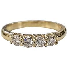 three stone diamond ring in yellow gold