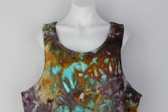 This gorgeous shirt is dyed with Procion Dyes and ice cubes, it looks even more amazing in person. Color - Chaotic Adventure / Pattern - crinkle Style - Men's tank top Material - 100% cottonSize- XLMeasurements- chest 46-48 inches / Waist - 40-42 inches Care Instructions - Machine Wash in COLD water / Hang to dry or tumble on LOW *You will receive this exact item. All of my tie dyes are one of a kind, No two are ever alike. Pre-washed with unscented detergent.❤️My mannequin is a size nothing! Measurements below....- 32" chest- 23" waist- 34" hips *Processing time on orders is 2 to 5 business days (m-f) before your order will be shipped. Multicolor Hand-dyed Sleeveless Top, Multicolor Hand Dyed Sleeveless Tops, Bohemian Sleeveless Hand Dyed Tops, Bohemian Sleeveless Hand-dyed Top, Hand Dyed Multicolor Sleeveless Tops, Bohemian Hand Dyed Sleeveless Top, Hand Dyed Sleeveless Bohemian Tops, Casual Hand Dyed Tank Top, Casual Hand-dyed Tank Top