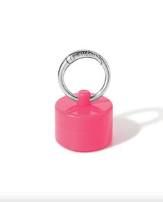 a pink container with a ring on it