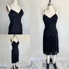 "A gorgeous gothic draped dress with a pleated skirt and drop waist  By Lillie Rubin  Side invisible zipper and hook & eye closure  Adjustable straps and lightly padded bra-type cups in bust  Fully lined in silky material  Marked size 2, estimated size small  Measurements: Bust: 32\" Waist: 27\" Hips: 36\" Shoulder to hem length: 41.5\" Condition: a few tiny pulls in the outer material, but they hide well with all the draping All items are vintage, which means they may have flaws from age and we Goth Halloween, Winter Park Fl, Floral Hat, Strappy Dress, Bra Types, Strappy Dresses, Winter Park, Draped Dress, Hook Eye