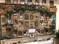 the wall is covered with many different pictures and decorations, including frames that have been made to look like christmas trees