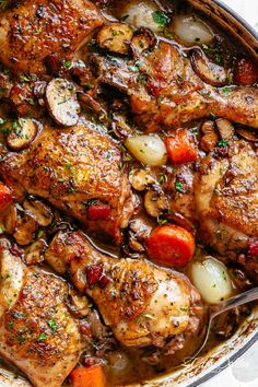 chicken with mushrooms and carrots in a pan