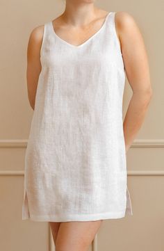 Elevate your summer wardrobe with our exquisite knee-length linen tunic. Crafted from lightweight and breathable linen fabric, this tunic offers the perfect combination of comfort and style. Whether you're strolling on the beach, exploring the city, or enjoying a casual outing, this versatile linen top is a must-have addition to your collection. Embrace the natural elegance of linen and indulge in the ultimate summer fashion.  ~ Includes 1 tunic; ~ OEKO-TEX Standard 100 certified fabric. * Pleas Spring Sleeveless Tunic, Summer Linen Tunic For Daywear, Summer Daywear Linen Tunic, Sleeveless Tunic For Spring Vacation, Sleeveless Spring Vacation Tunic, Spring Vacation Sleeveless Tunic, Summer Linen Tunic For Loungewear, Summer Linen Sleep Dress, Summer Linen V-neck Tunic