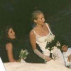 the bride and groom are sitting down together