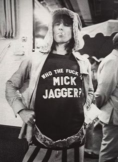 a black and white photo of a man wearing a t - shirt that says, who the fock?