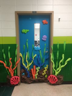 a door decorated with seaweed and corals