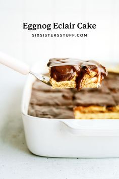 eggnog eclair cake with chocolate frosting in a white baking dish