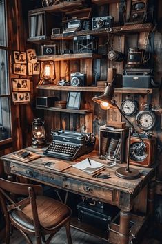 an old fashioned typewriter sitting on top of a wooden desk next to a lamp