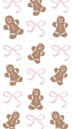 a bunch of brown and pink gingerbreads on a white background, with bows