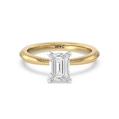 a rose gold engagement ring with an emerald cut diamond in the center and beading around the band