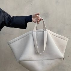 The light weight mesh A E K I Bag is a Jasmin Shokrian classic. The Large A E K I Bag was originally developed in 2015 as a part of the Jasmin Shokrian SS 2105 collection. Based on a Utilitarian classic this oversized, Lightweight durable bag is great as a day time accessory, and is perfect as a both a carry all and a carry on.Currently available in a classic JS ATELIER palette of NUDE, MIDNIGHT and BLACK. As well as TENNIS, WEED GREEN, COYOTE and THIRST. Please note that this Item is currently Accessories Inspiration, Day Time, Unique Bags, Day And Time, Carry On, Bag Accessories, Tennis, Pouch, Mesh