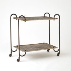 a metal shelf with two shelves on wheels