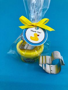 "This play doh party favor comes with a mini container (1oz) of Play Doh and a metal duck cutter presented in a clear bag with a duck themed thank you tag which can be personalized with \"From, Your Name\" - if you would like this option please select the quantity you would like and (personalized) after it, and leave the name you'd like on the tag in the personalization details. You can choose a color for the ribbon bow - please select when ordering. Please note that you will receive a selection Duck Party Favors, Rubber Duck Birthday Party Ideas, Rubber Duck Party, Duck Birthday Theme, Donald Duck Party, Ducky Party, Rubber Ducky Party, Play Doh Party, Rubber Ducky Birthday