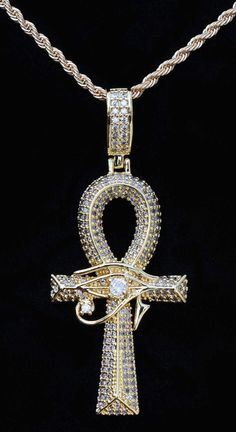 Exquisite Egyptian Large CZ Ankh with Eye of Horus overlay and many micro-pave cubic zirconium stones inlaid in Gold filled Ankh including a larger CZ stone as the Eye of Horus--simply STUNNING! ONLY {1} AVAILABLE! Large Ankh Charm | Eye of Horus  is gold filled with a hollow back ❤ A Powerful and Ancient Gift      for the One you Love  ❤ Gift for Him or for Her ❤ Rope Chain is made of       stainless steel with gold plating     = 2mm wide  CHOOSE YOUR CHAIN LENGTH FROM OUR PULL-DOWN MENU:  ❤    45 cm / 17.7 inches long      w/ lobster clasp. Will NOT tarnish OR  ❤    50 cm / 19.7 inches long      w/ lobster clasp. Will NOT tarnish OR  ❤    55 cm / 21.6 inches long      w/ lobster clasp. Will NOT tarnish OR  ❤    60 cm / 23.6  inches long      w/ lobster clasp. Will NOT tarnish ❤ Ankh Char Ankh Jewelry Necklaces, Ankh Wallpaper, Egyptian Jewelry Ancient, Ankh Jewelry, Jewelry For Him, Ancient Egyptian Jewelry, Dope Jewelry Accessories, Ankh Necklace, Earthy Jewelry