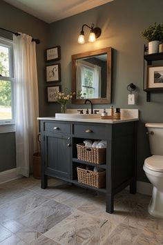 a bathroom with a toilet, sink and mirror in it's centerpieces