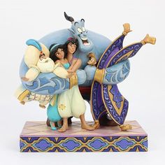 the figurine depicts an animated scene with two women and a baby in front of a blue dragon