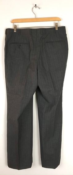 "-Description- >men's dark gray dress pants with white & red pinstripes >clip and zipper front >belt loops >open pockets in the front >one open and one button close pocket in the back >size 34 waist >great for a dressy event! >condition: very good >color(s): gray, red, white >fabric(s): woo. >brand: none >care: dry clean -Measurements- >size: 34 waist ✩ all measurements are taken with the item laying flat & some sizes are estimates so please check m Business Striped Pants With Belt Loops, Business Straight Leg Striped Dress Pants, Fitted Striped Pants With Belt Loops, Fitted Pinstripe Dress Pants For Office, Classic Striped Dress Pants For Office, Dark Gray Dress, Dress Pants Mens, Dark Grey Dress Pants, Gray Dress Pants