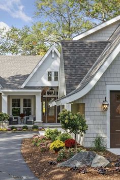 a white house with a brown garage door